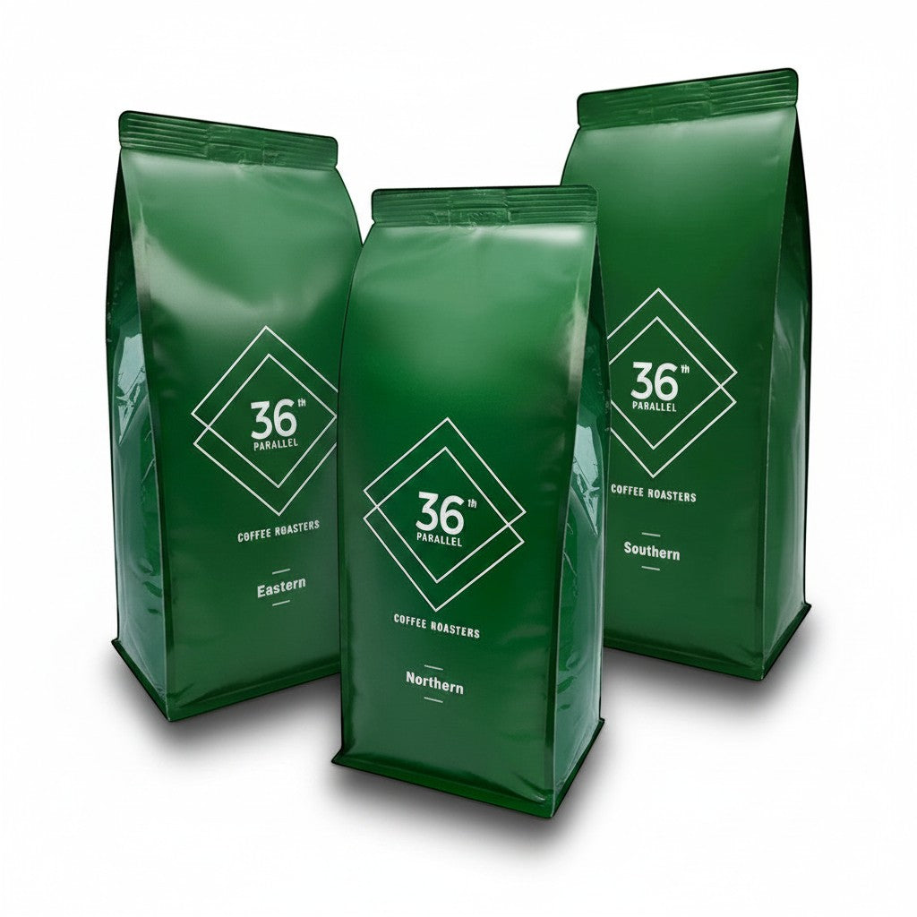 36th Parallel Specialty Coffee Roasters green blend pack featuring Eastern, Northern, and Southern coffee blends.